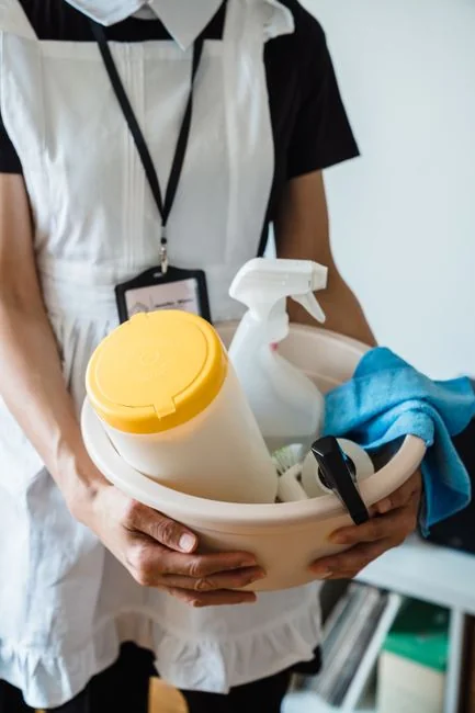 a-woman-is-cleaning-a-kitchen-sink-with-a-rag-sqomdoqb3ws